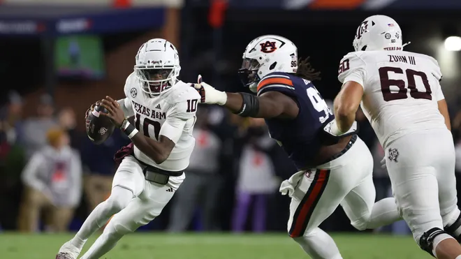 Cover Image for Auburn defeats Texas A&M in a closely contested football game.